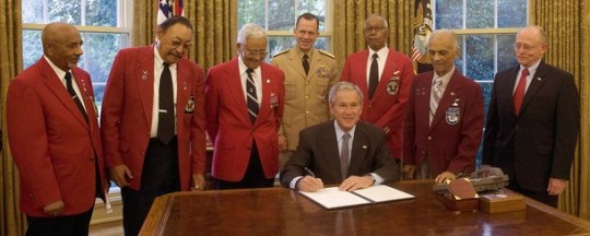 US President George W. Bush (C) signs Pr