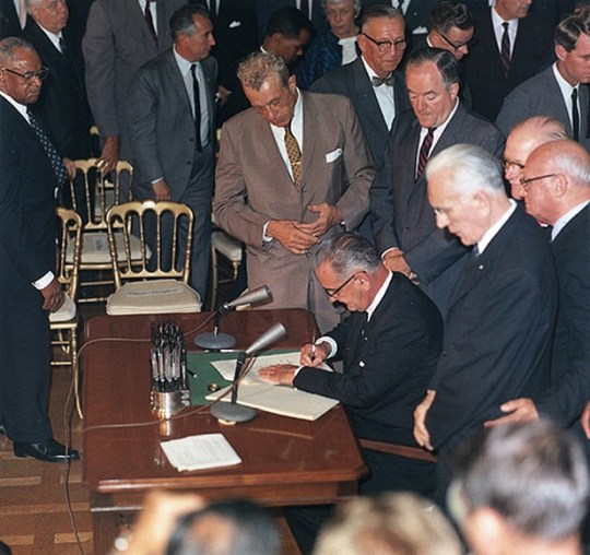President Lyndon B Johnson signs Civil Rights Act of 1964